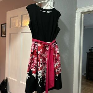 Black top, floral skirted dress, size 12